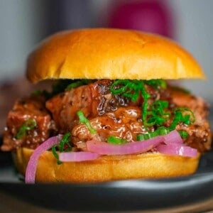 A close up shot of a chopped brisket sandwich.