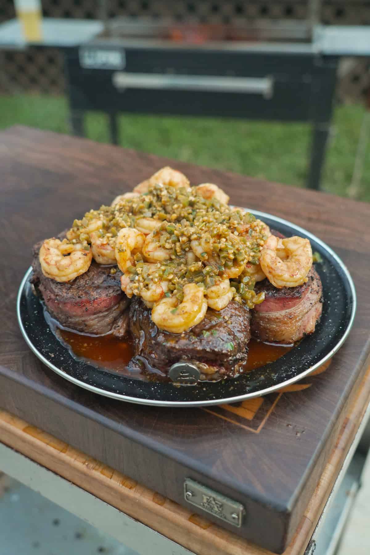 A shot of the whole place with bacon wrapped filets smothered in spicy shrimp.