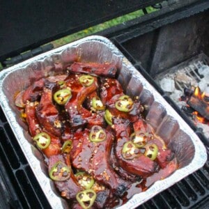 Honey fire party ribs in the crutch on the smoker.
