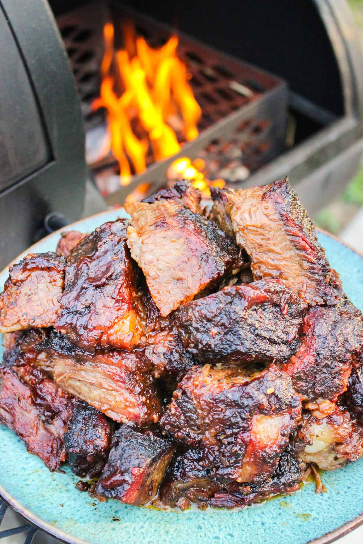 The served brisket burnt ends piled on a plate.