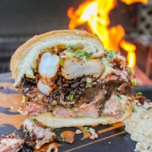 Surf and Turf Sandwich sliced in half so you can see the inside layers.