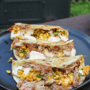 Pulled Pork Elote Tacos assembled so that we can go serve them.