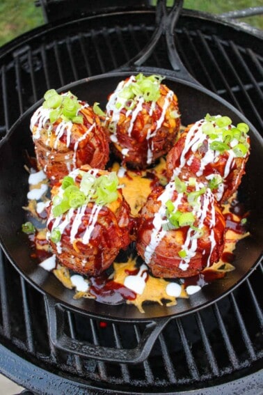 finished BBQ volcano potatoes topped with garnishes overhead