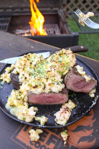 The grilled steak with lobster Mac and cheese assembled and served.