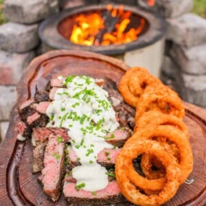 Steak in Beef Tallow sliced and topped with the Hatch Chile Blue Cheese Sauce.