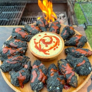 The smoked bat wings plated and served.