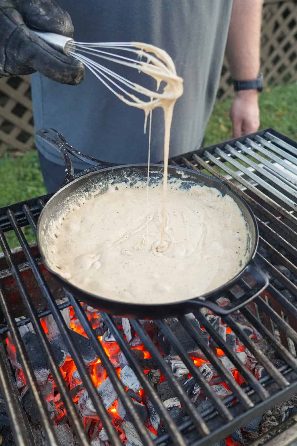 The fondue for the cheeseburgers is bubbling and ready to go.
