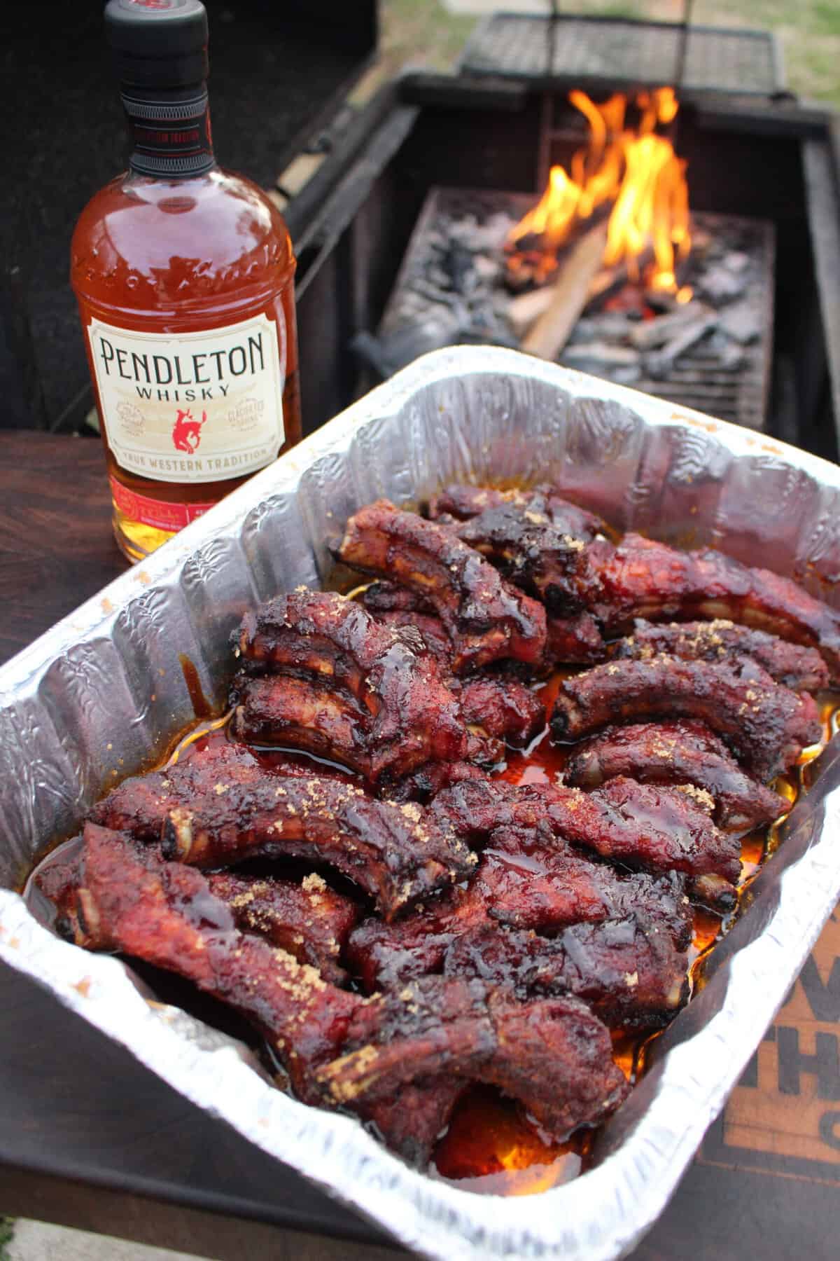 Smoked party ribs cooked in a crutch with Pendleton Whisky.
