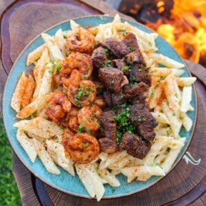Cajun steak and shrimp alfredo, served and ready to eat.