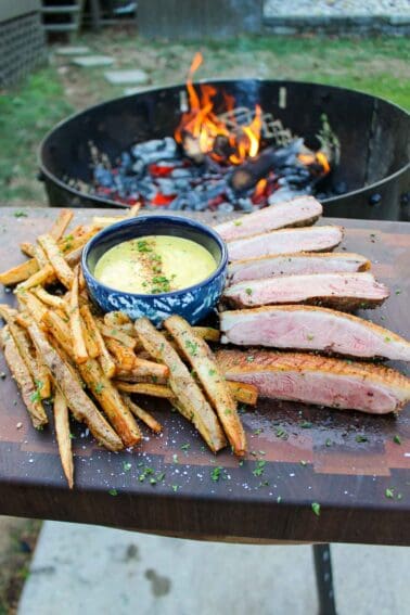 Duck steak frites is ready to eat.