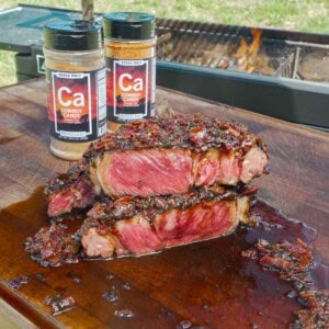 The Cowboy Candy Rubbed Grilled Steak with Bacon Jam is cooked, sliced, and ready to devour.