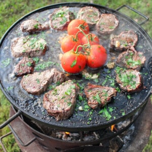 Salt Bae Steaks sizzling on the plancha.