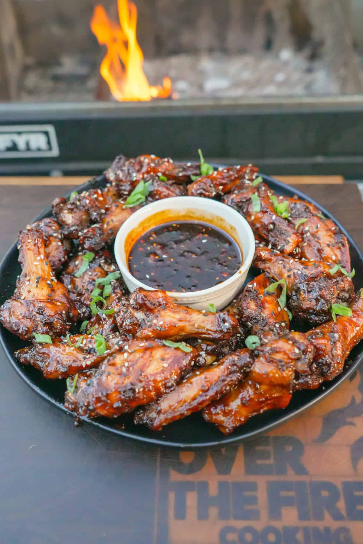 The final dish, serving with dipping sauce on a large plate.