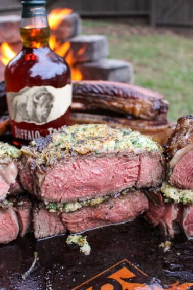 Tomahawk Steaks with French Onion Crust sliced and ready to eat.