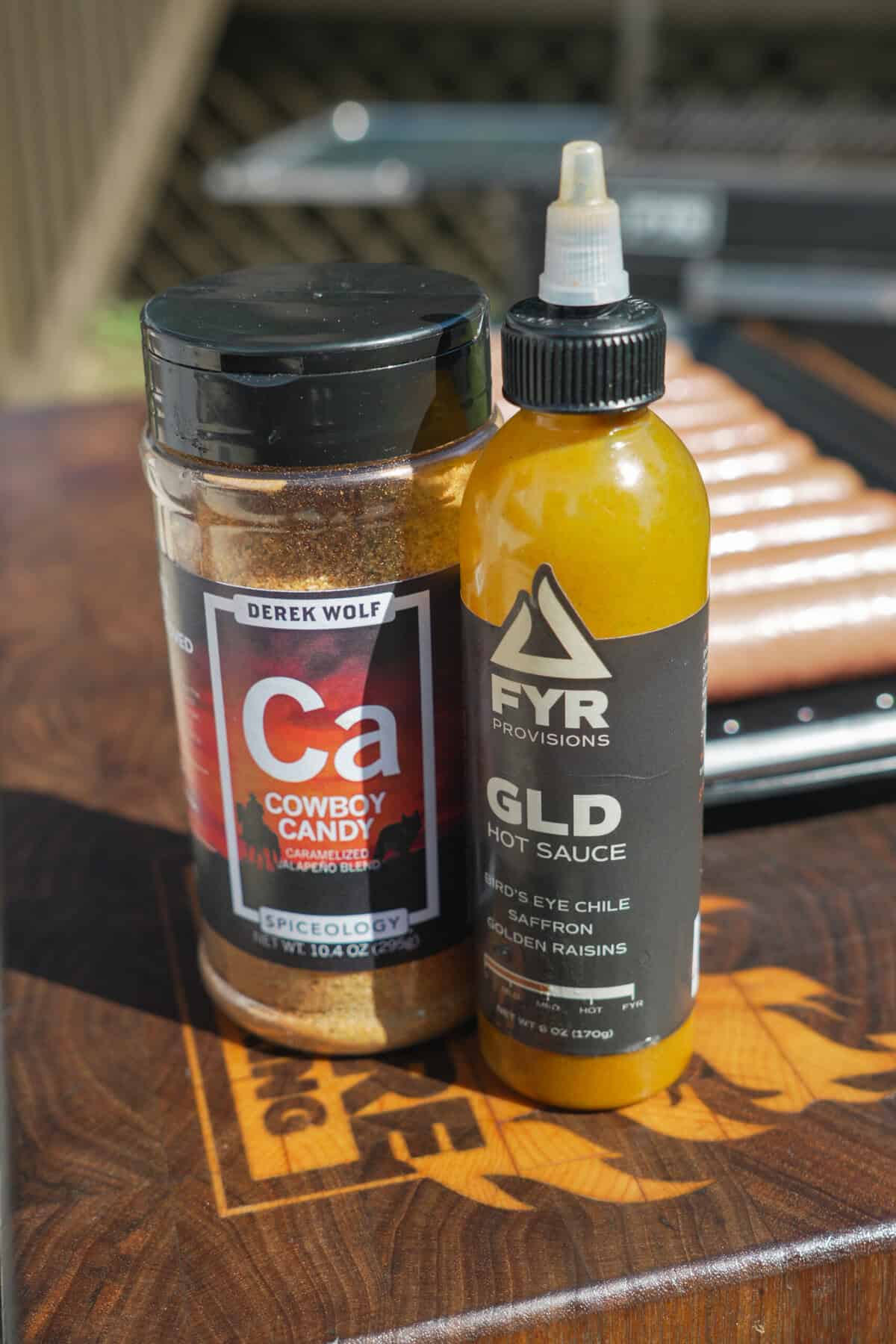 Cowboy Candy and FYR GLD sauce on the cutting board.