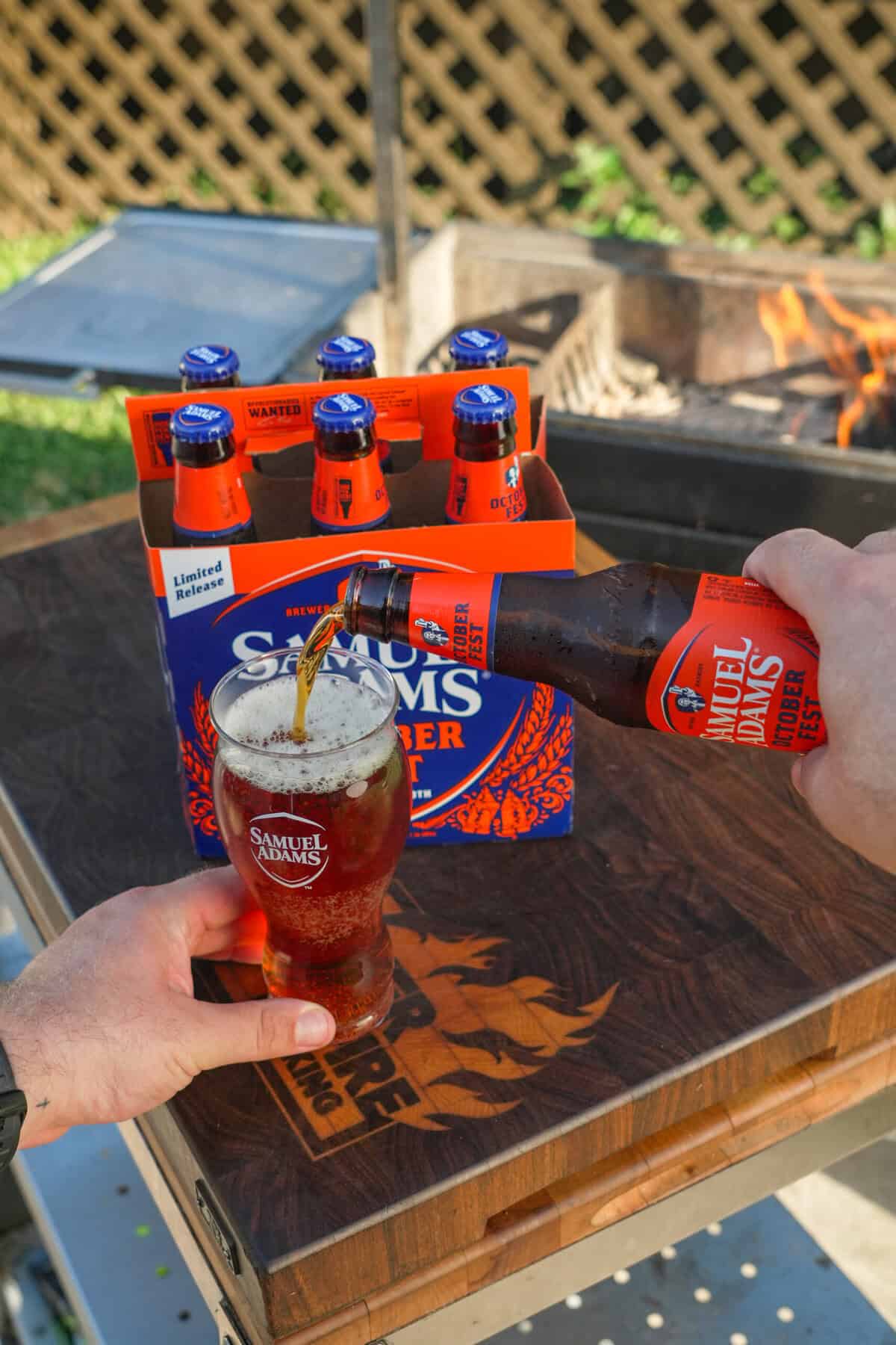 Sam Adams Octoberfest being poured into a glass, ready to enjoy with the Sausage Beer Cheese Dip.