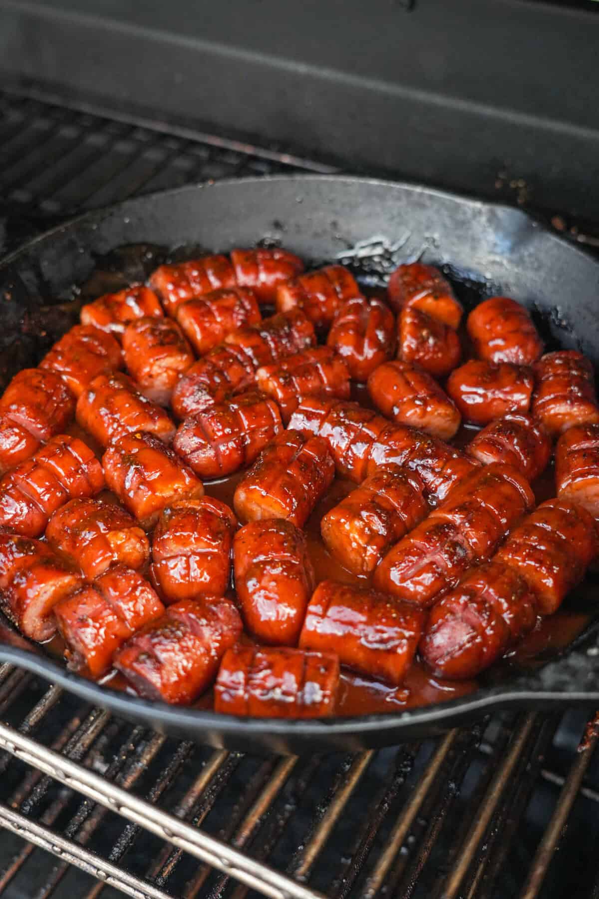 The smoked dogs on the smoker.