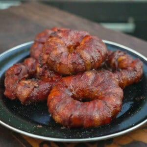 Cowboy Stuffed Onion rings piled on a serving plate.