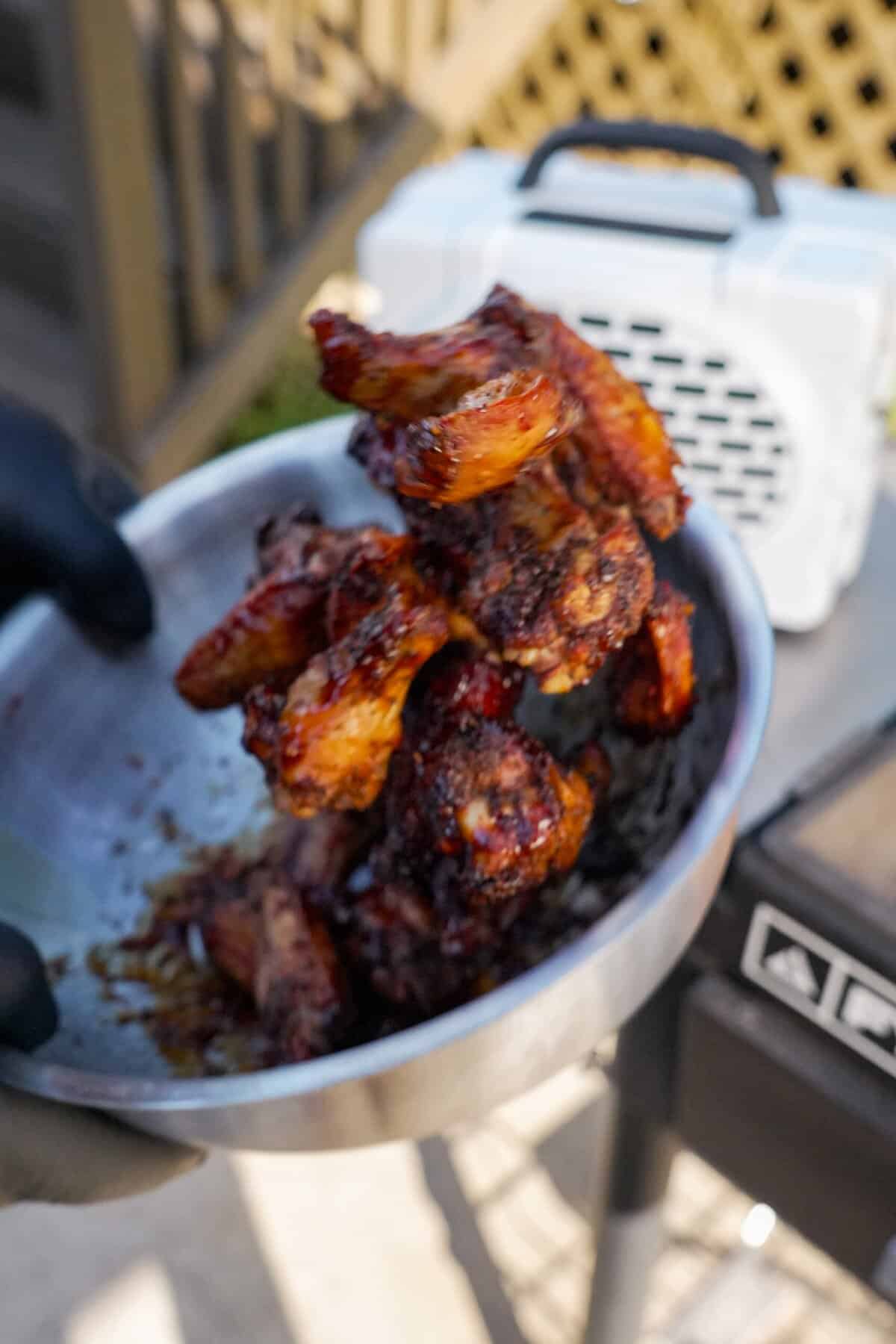 Tossing chicken with glaze