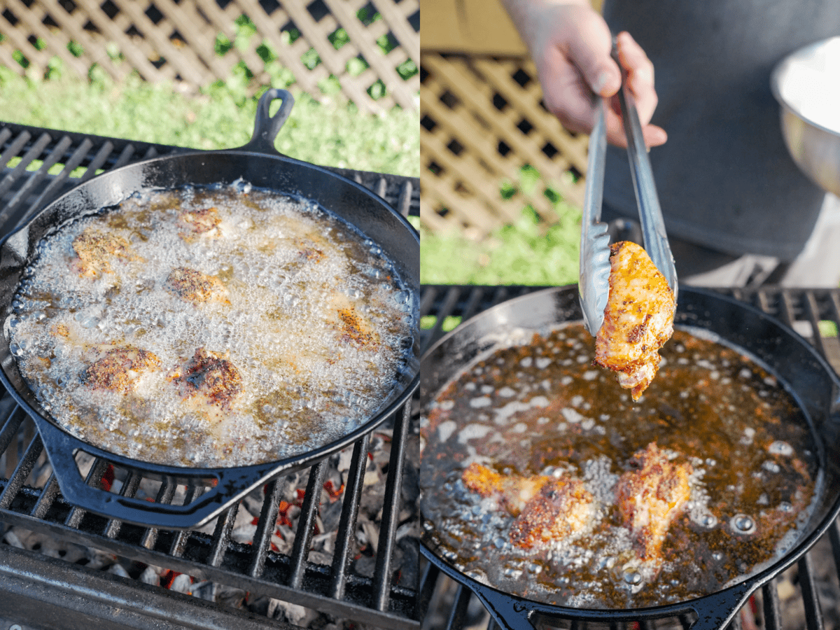 Frying chicken wings in vegetable oil in a skillet on the grill and removing with tongs