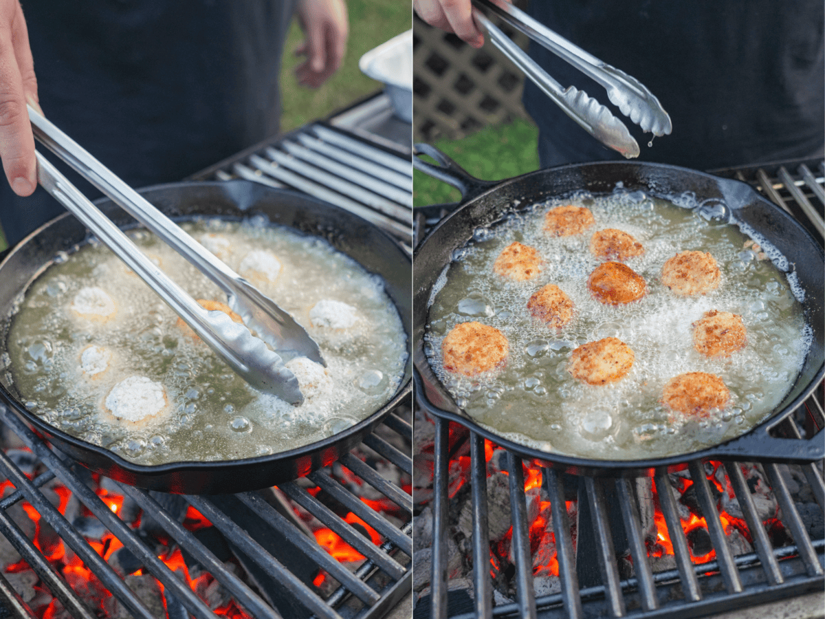 Using tongs to fry jalapeño popper croquettes in a cast iron skillet with hot frying oil