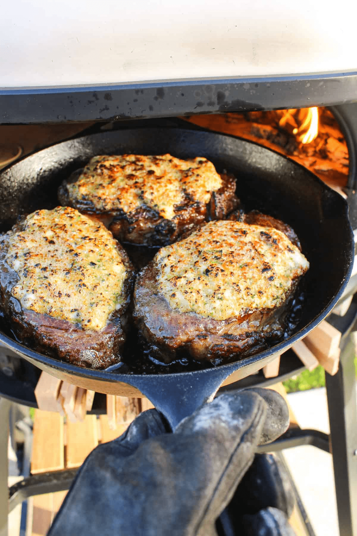 Steaks headed into the oven for their final sear.