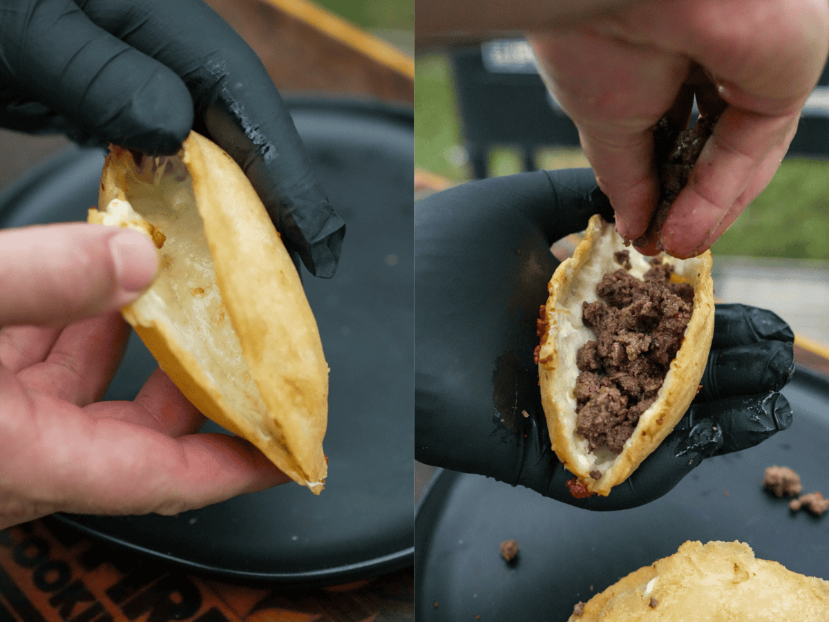 Opening a cooked fried quesadilla stuffed with cheese and adding cooked ground beef