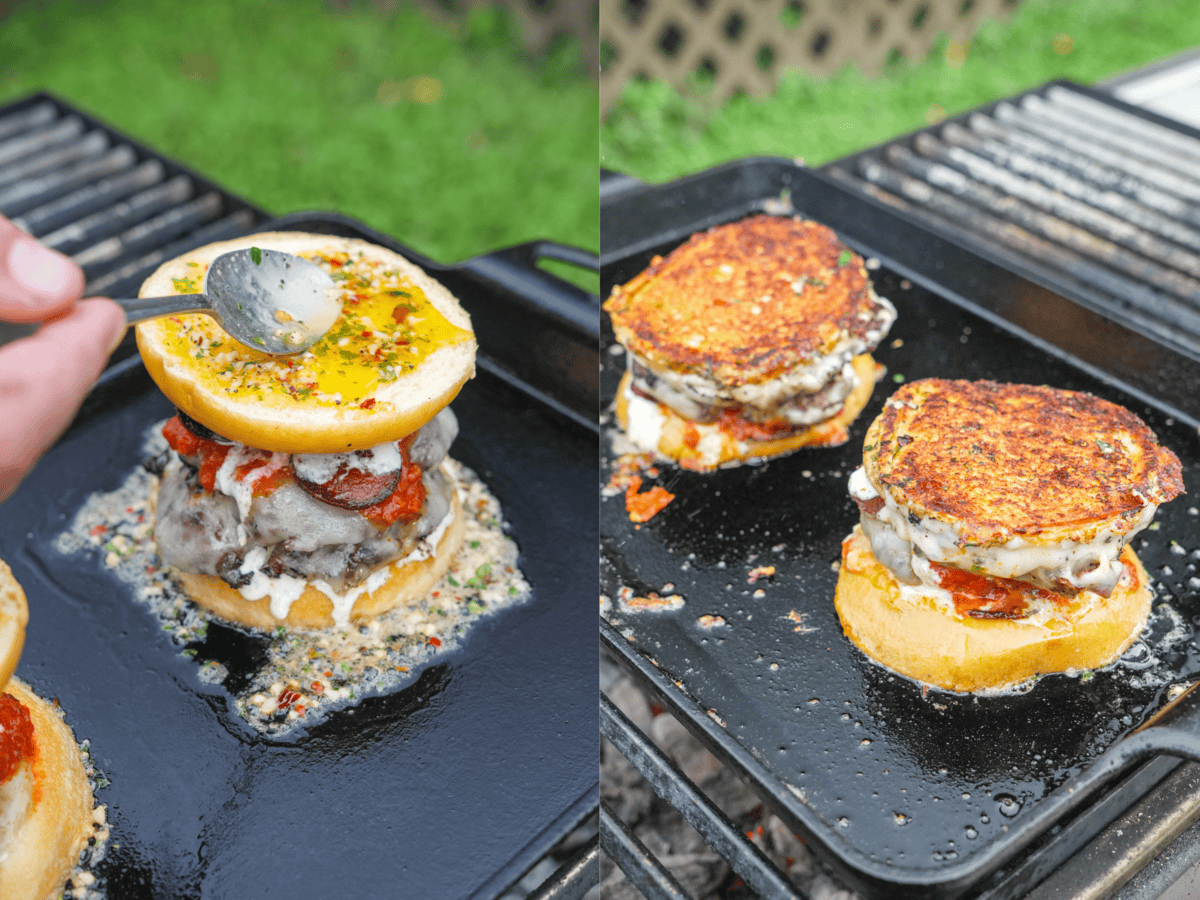 Searing assembled pizza smashburgers on a plancha on the grill and spooning butter over the top bun
