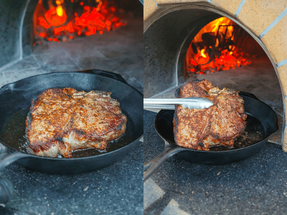 Searing the seasoned Peter Lugar steak on a hot skillet by the fire.